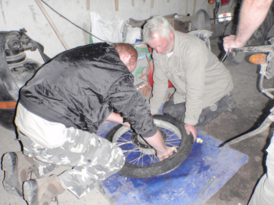 088 John and Javier take over the tyre change.jpg